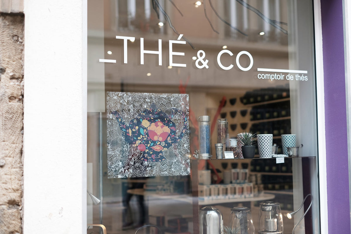 High-clarity clear PET display film illustrated with printed branding on a tea-shop window.
