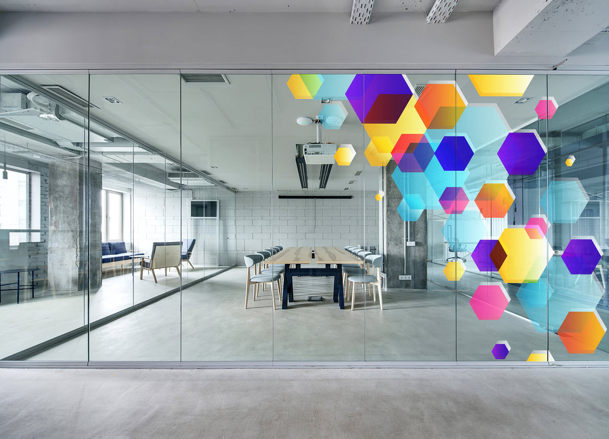 Optically clear printable PET window film illustrated with colourful hexagon graphics on office glass.