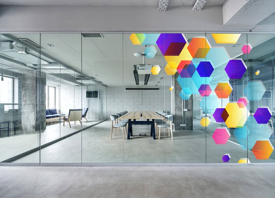 Optically clear printable PET window film illustrated with colourful hexagon graphics on office glass.